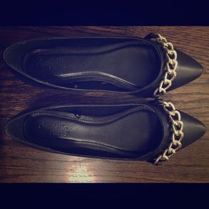 Black flats with gold chain link. Worn once.